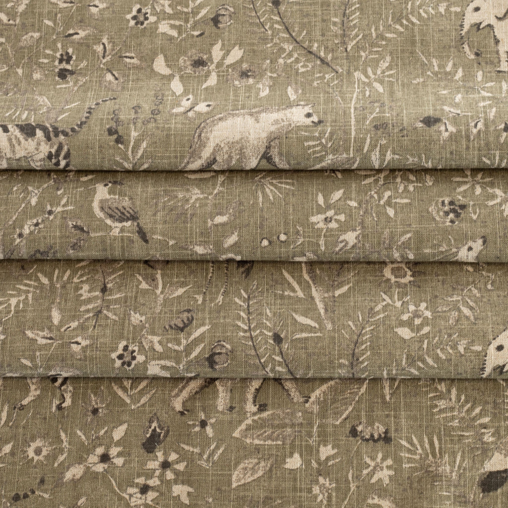 a green botanical and exotic animal patterned tonic living fabric 
