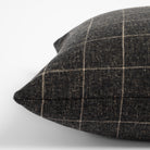 Dundee Sable, a charcoal grey and natural windowpane pillow : close up side view