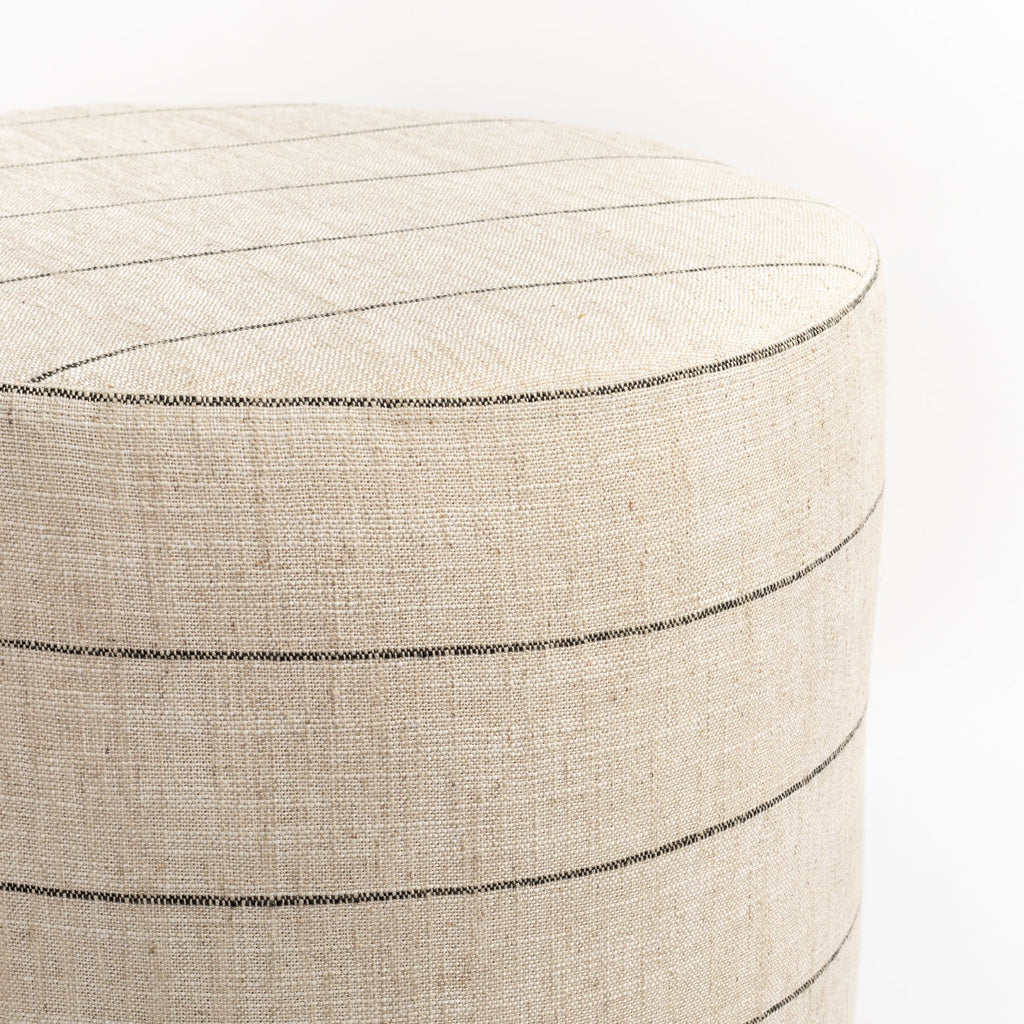 Dunrobin Round Ottoman Burlap, a beige with black stripe fabric round ottoman : close up top view