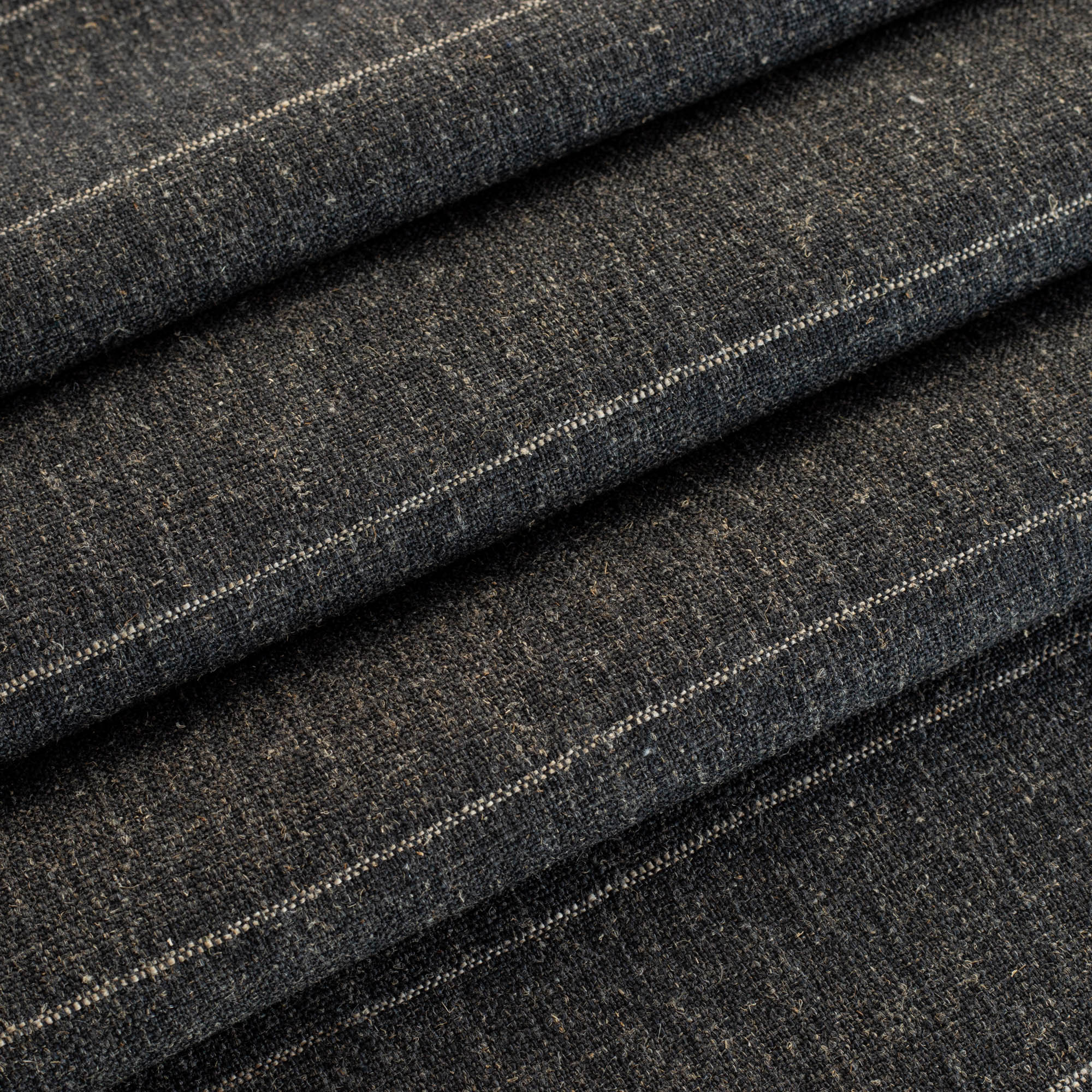 a charcoal gray and tan stripe upholstery fabric