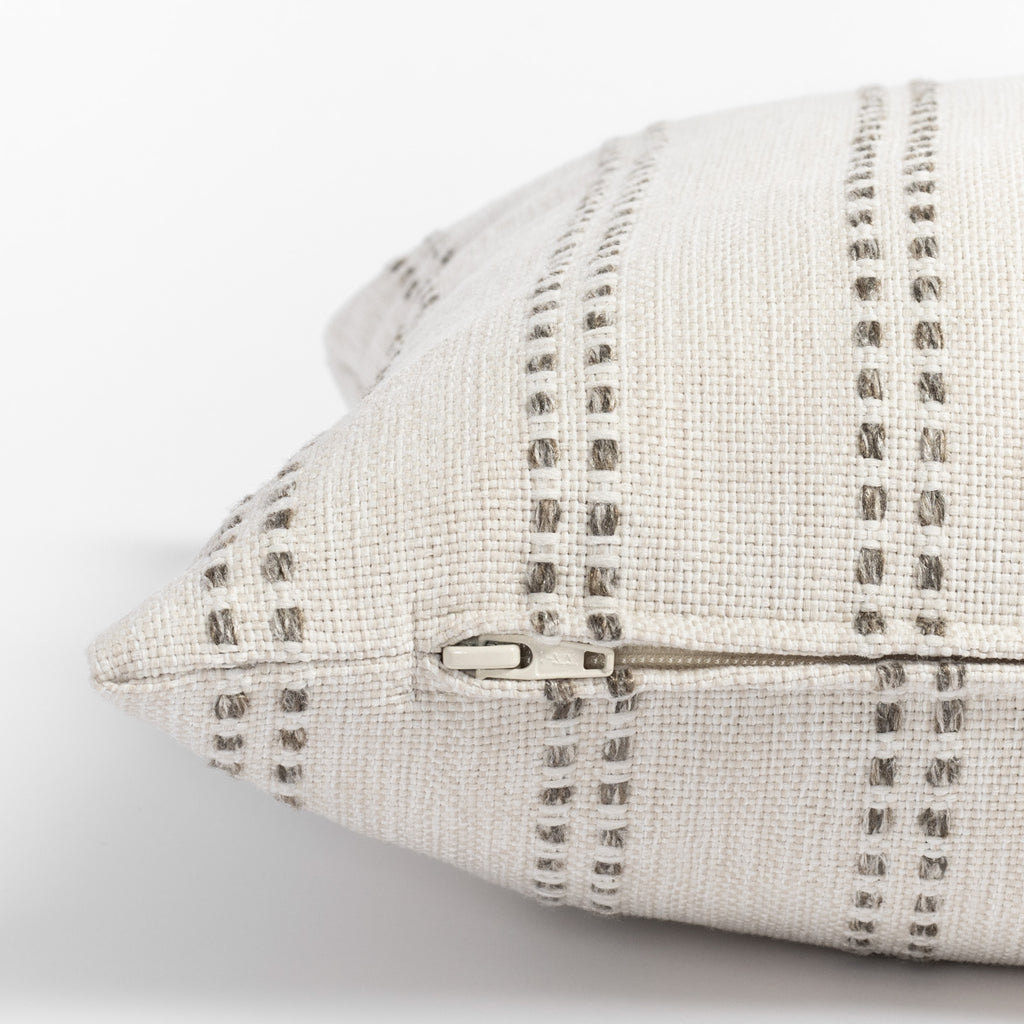Elodie Felt, a cream with beige vertical dot stripes lumbar pillow : close up zipper view