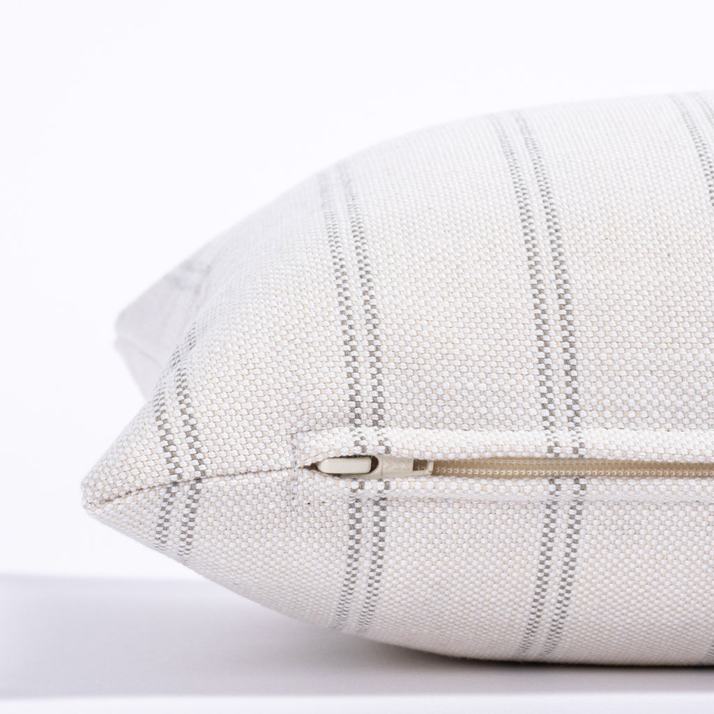 cream and gray vertical stripe lumbar pillow : side close up view