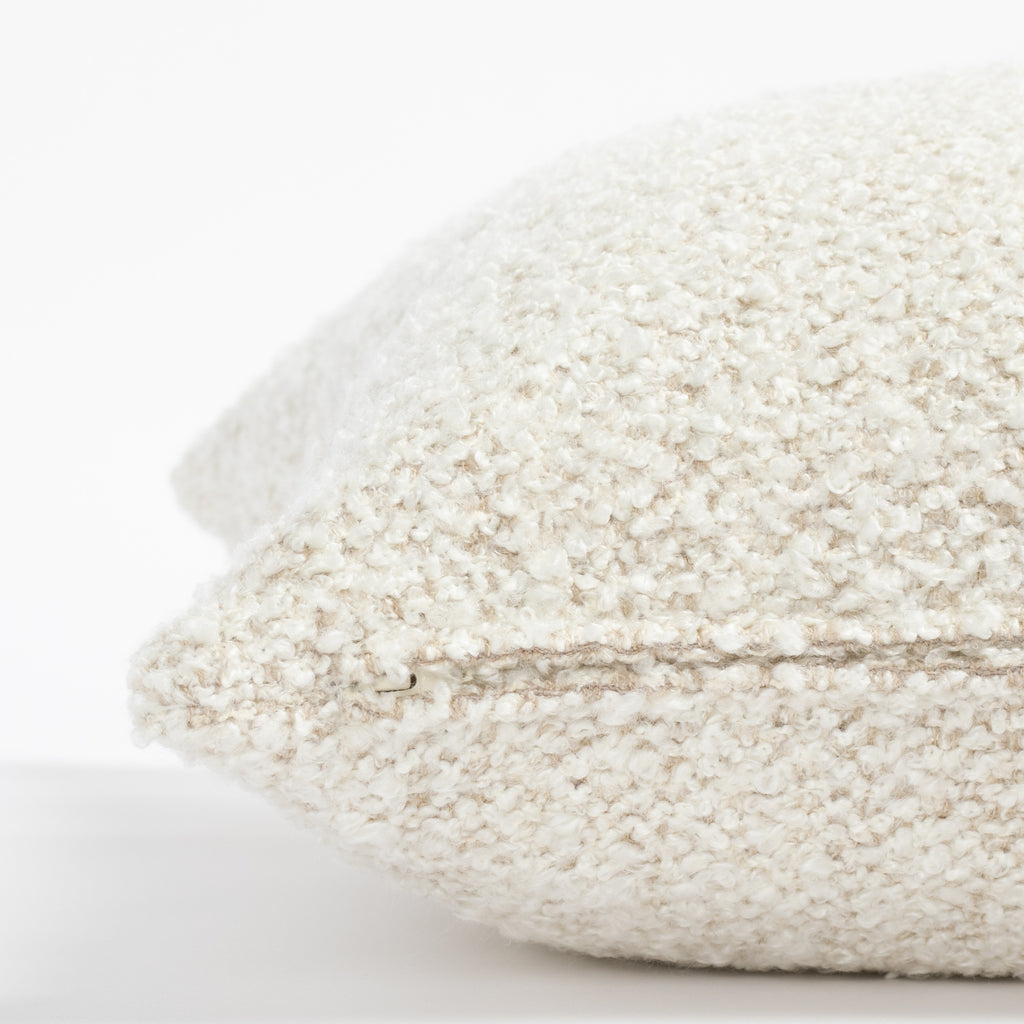 a cream boucle throw pillow: 22x22 pillow cover zipper detail