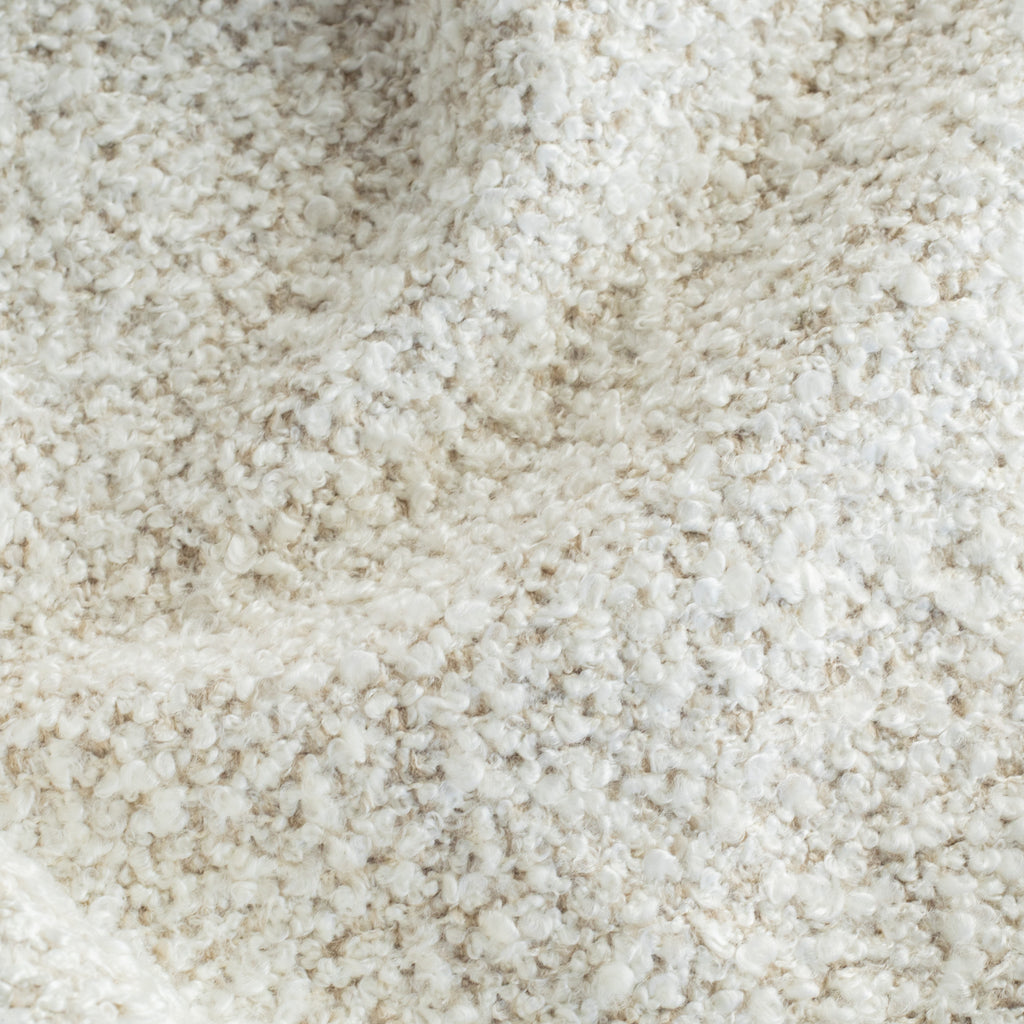 a cream boucle textured upholstery fabric 