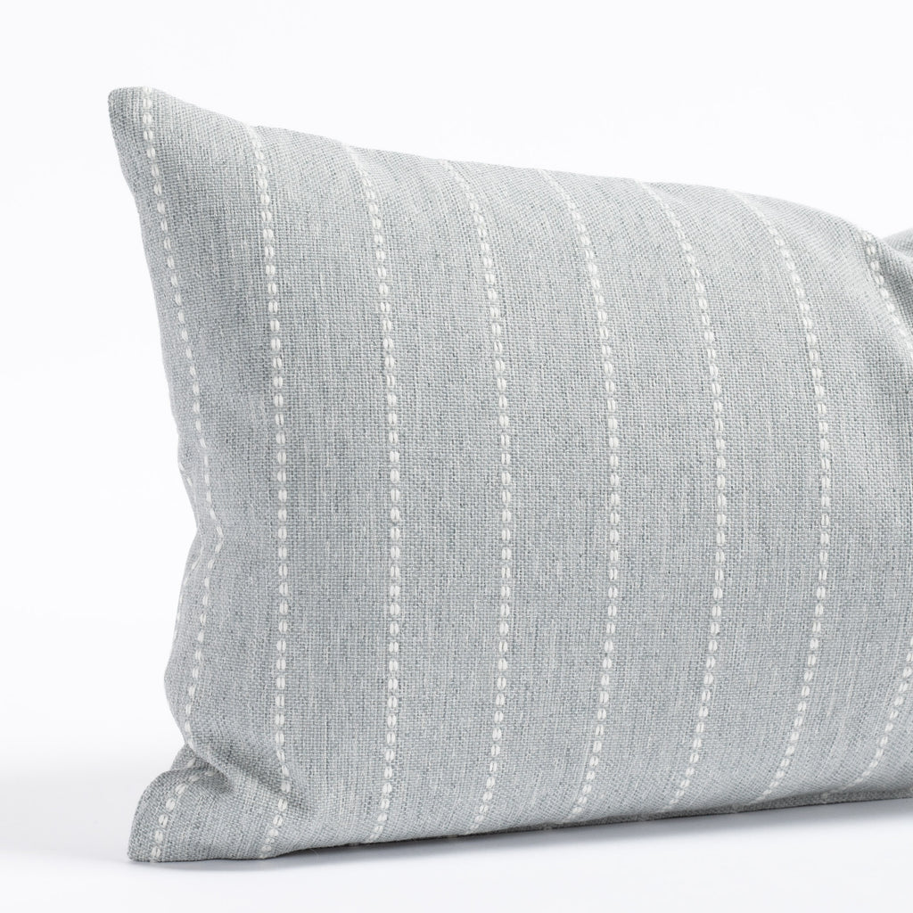 a blue gray with white stripe indoor outdoor lumbar pillow 
