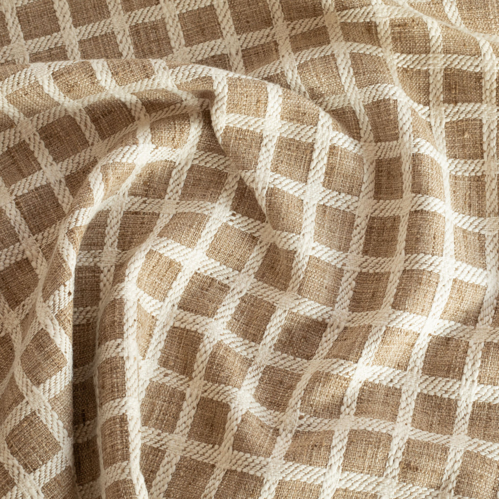 a light brown and cream check upholstery fabric