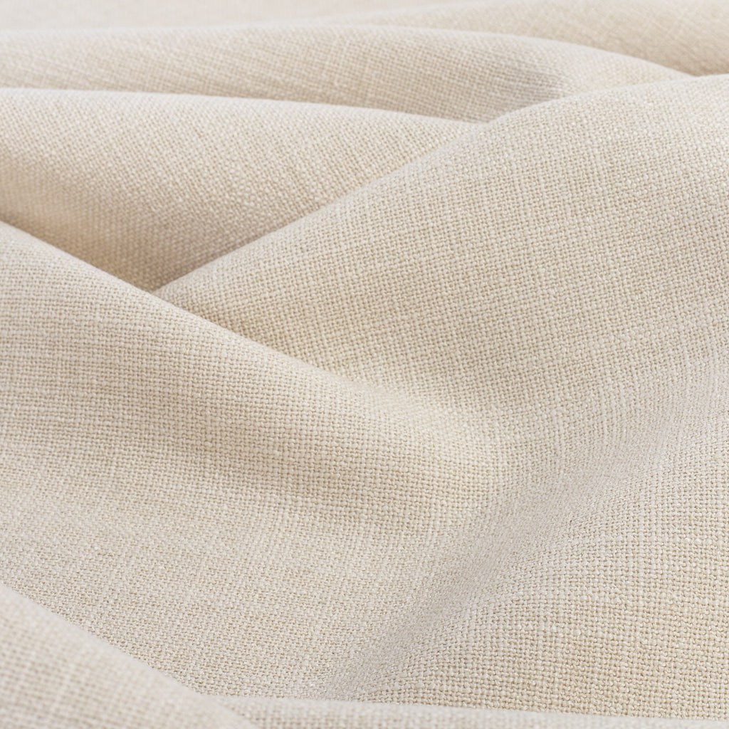 Grange Fabric Parchment, a high performance sandy beige upholstery fabric with a subtle textural weave from Tonic Living