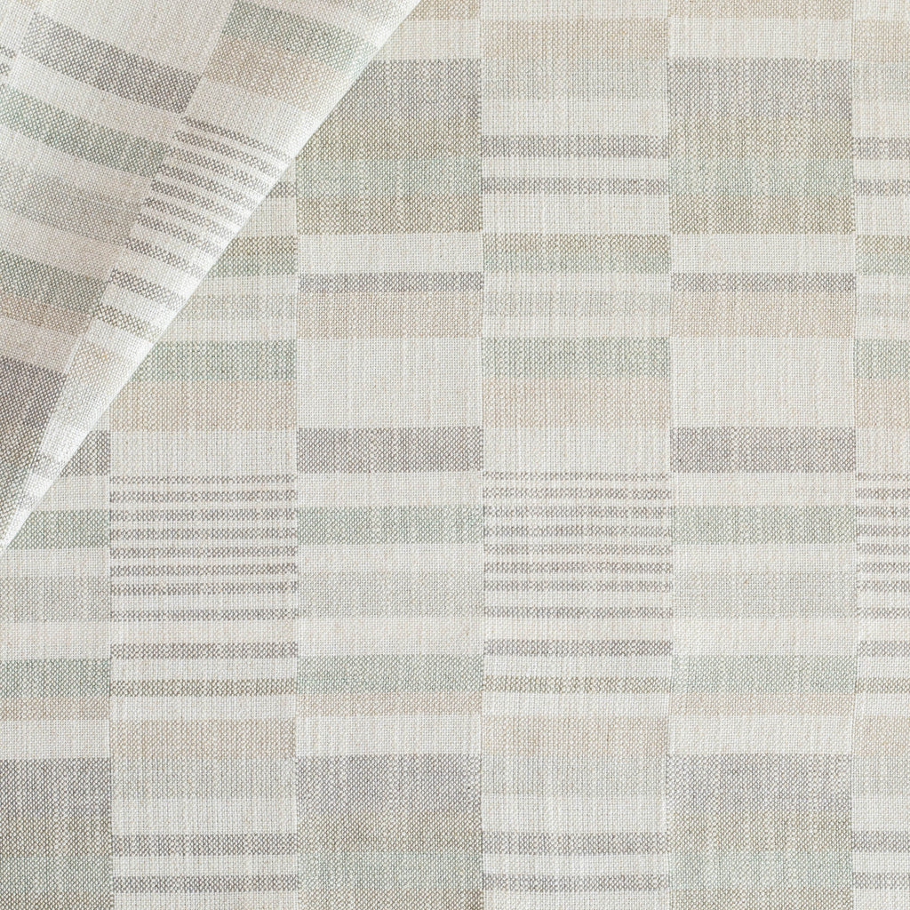 a geometric patchwork patterned upholstery fabric in costal watery blue, green, gray colours from Tonic Living