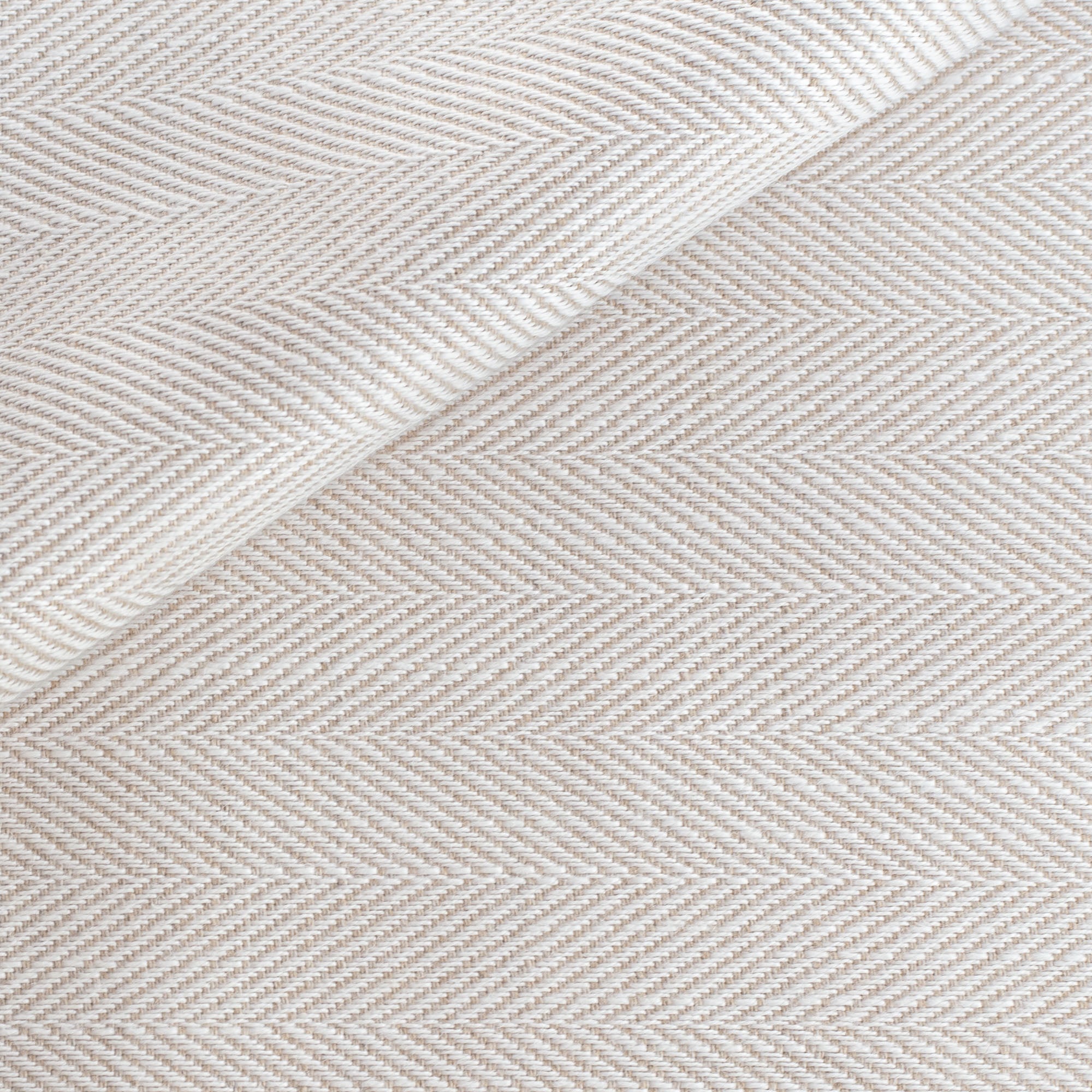 a cream and beige herringbone performance fabric 