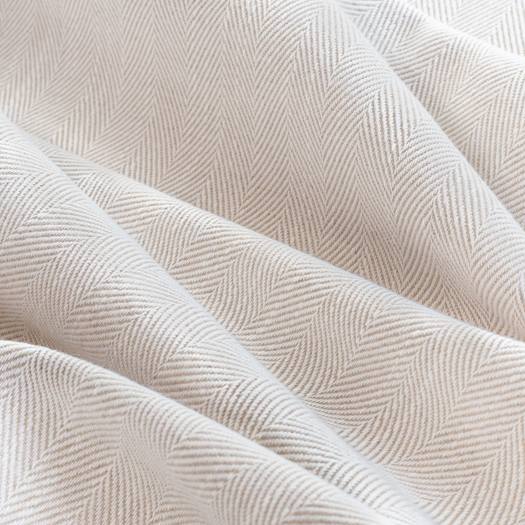 Harris Alabaster, a cream and tan herringbone performance fabric from Tonic Living