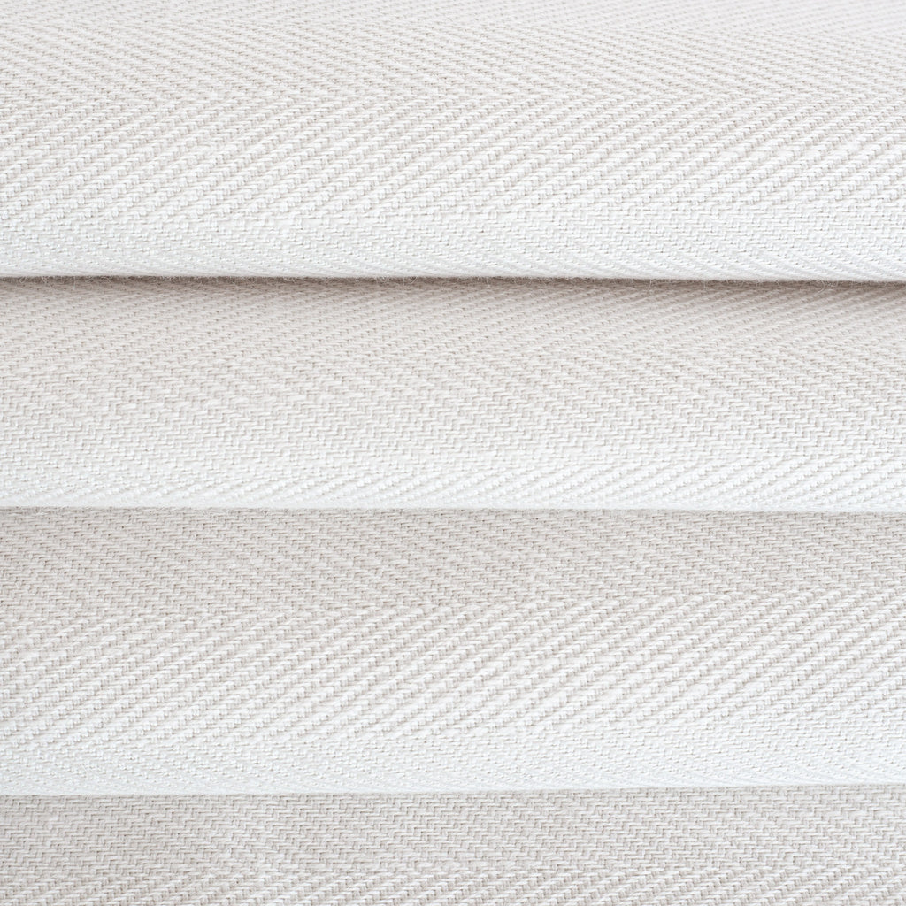 Harris White, a soft white herringbone pattern performance upholstery fabric : close up view