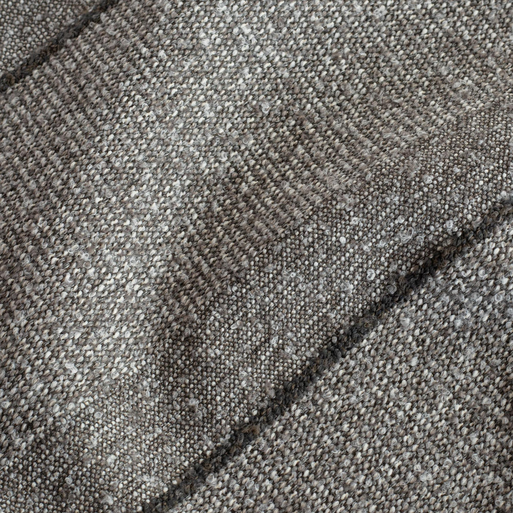 a textured tonal gray stripe upholstery fabric : close up view