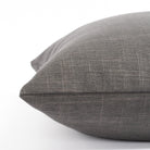 a smoke grey throw pillow : side view