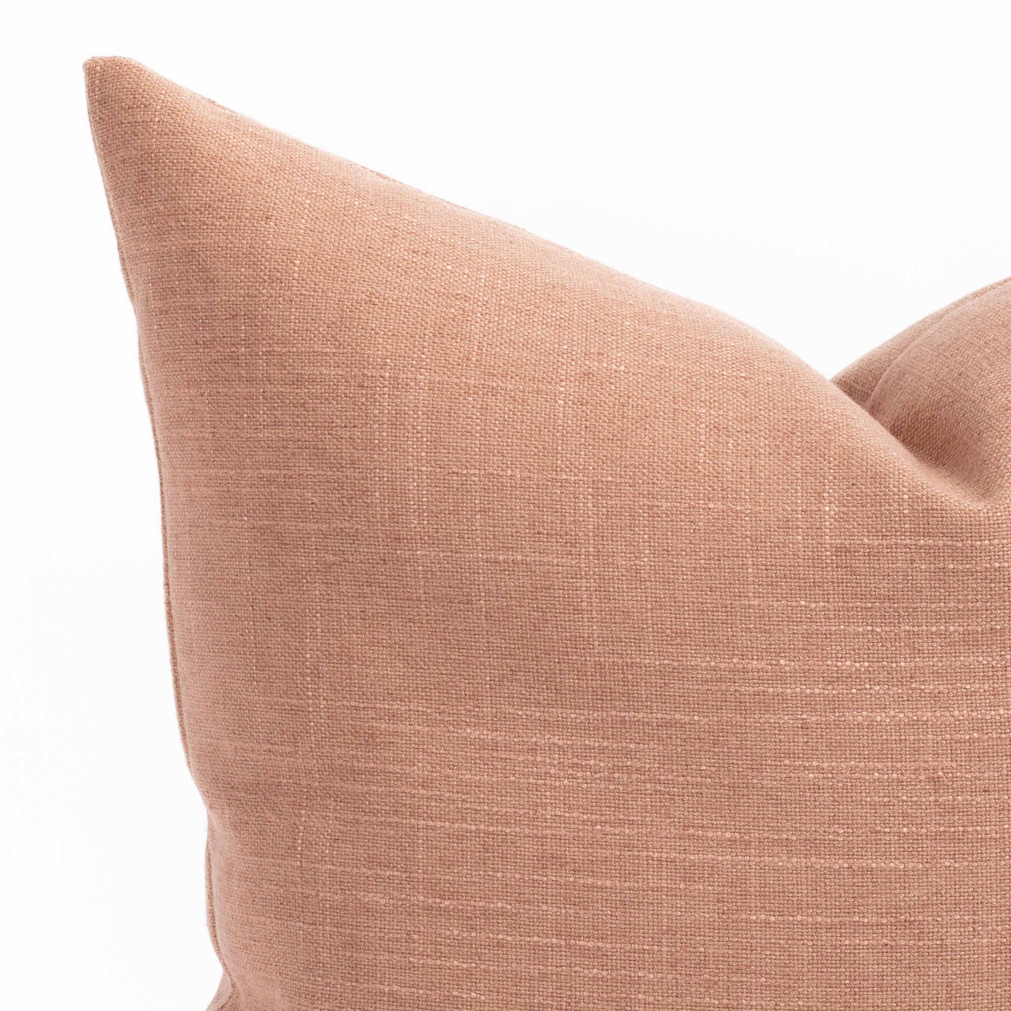 a terracotta orange pink throw pillow : close up photo