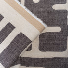 grey and beige print fabric