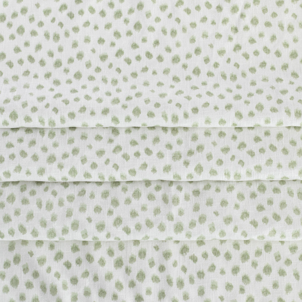 a white and green inky dot print home decor fabric