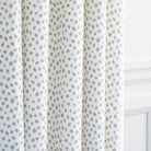 a white and silver gray inky dot print drapery fabric