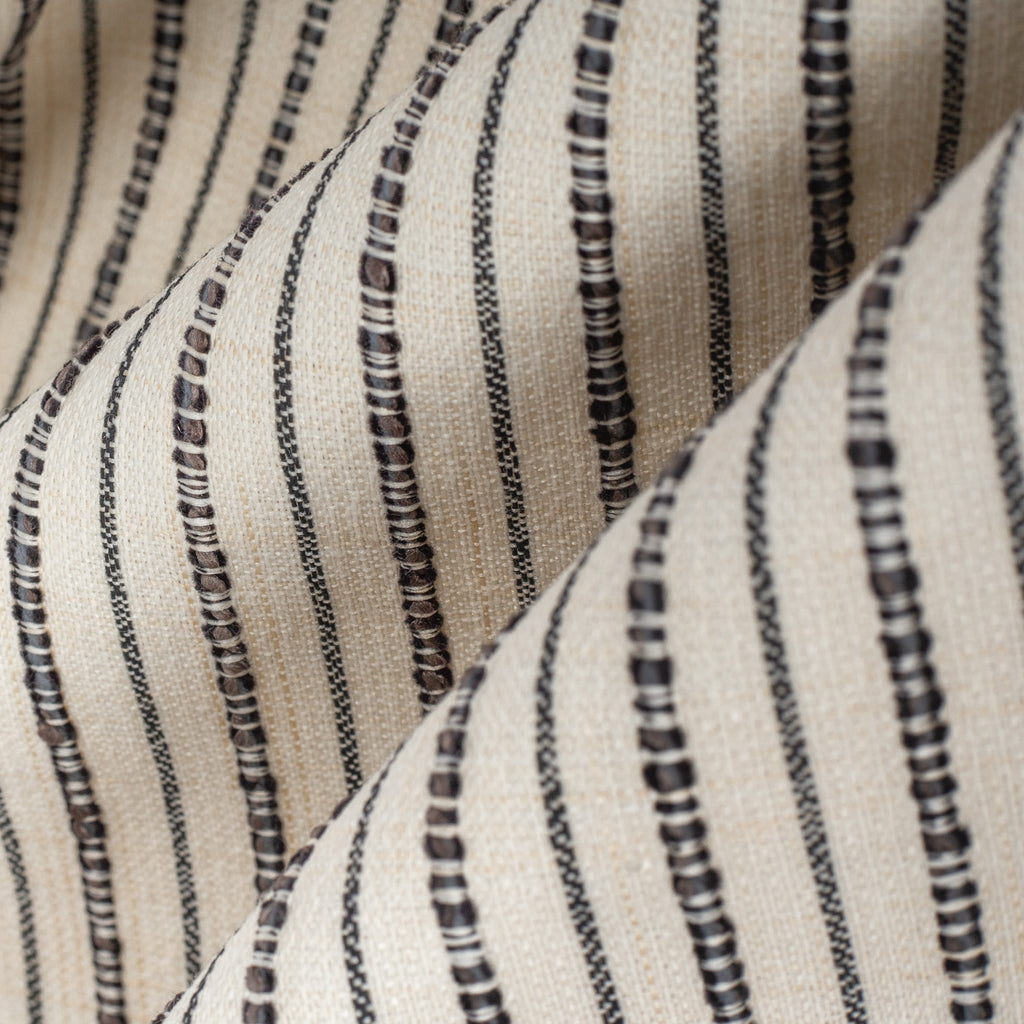 Misto Stripe Cream, a faded cream and black striped Crypton home performance fabric : close up view