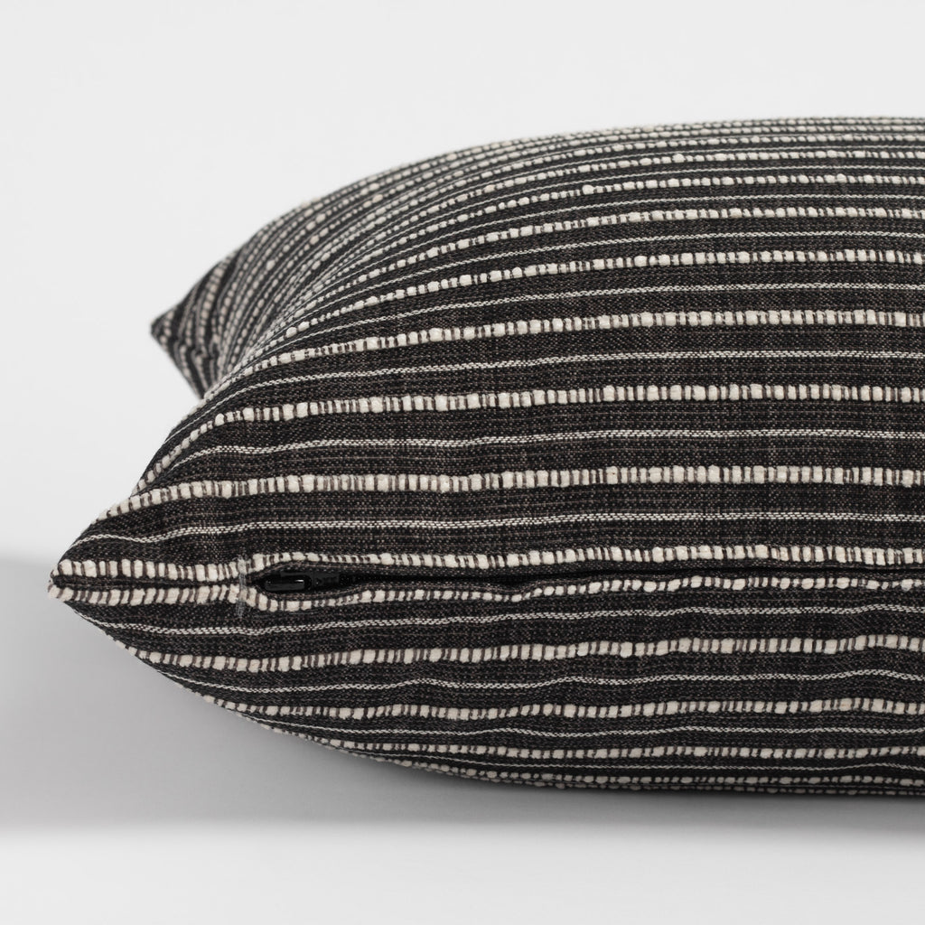 Misto charcoal bed bolster, a black and cream horizontal stripe extra long lumbar pillow : zipper detail