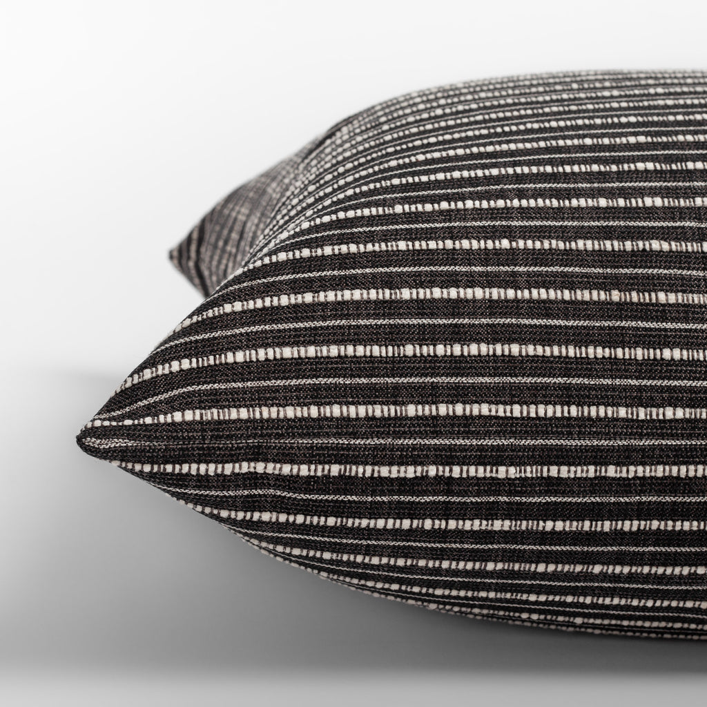 Misto Charcoal Pillow,  a faded black and textured cream stripe pillow : close up side view