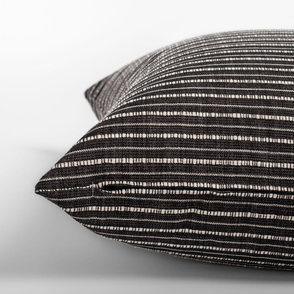 Misto Charcoal Pillow,  a faded black and textured cream stripe pillow : close up zipper detail