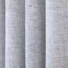 Normandy Linen Salt and Pepper, a white and deep navy blue linen drapery fabric from Tonic Living
