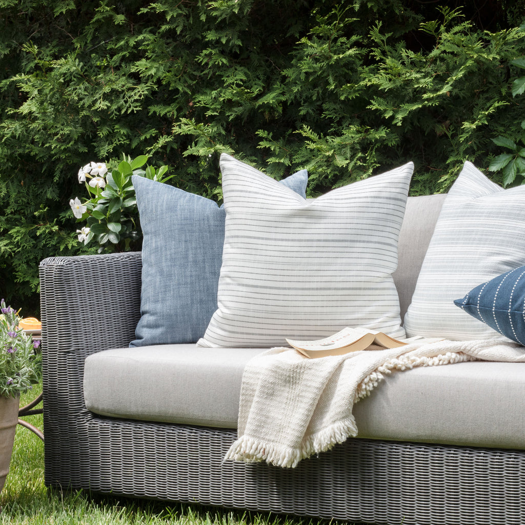 Outdoor Vignette : Black, white and grey indoor outdoor pillow with blue pillows from Tonic Living