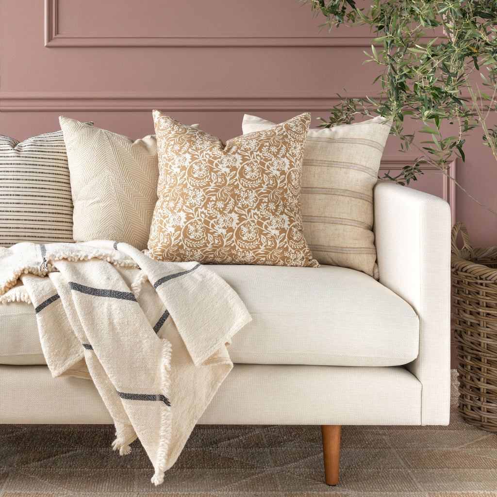 Sofa pillow combination: Padma nutmeg pillow shown with neutral pillows