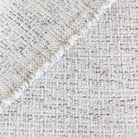 Preston Birch Indoor outdoor fabric, a light cream fabric, with strands of warm gray: close up view