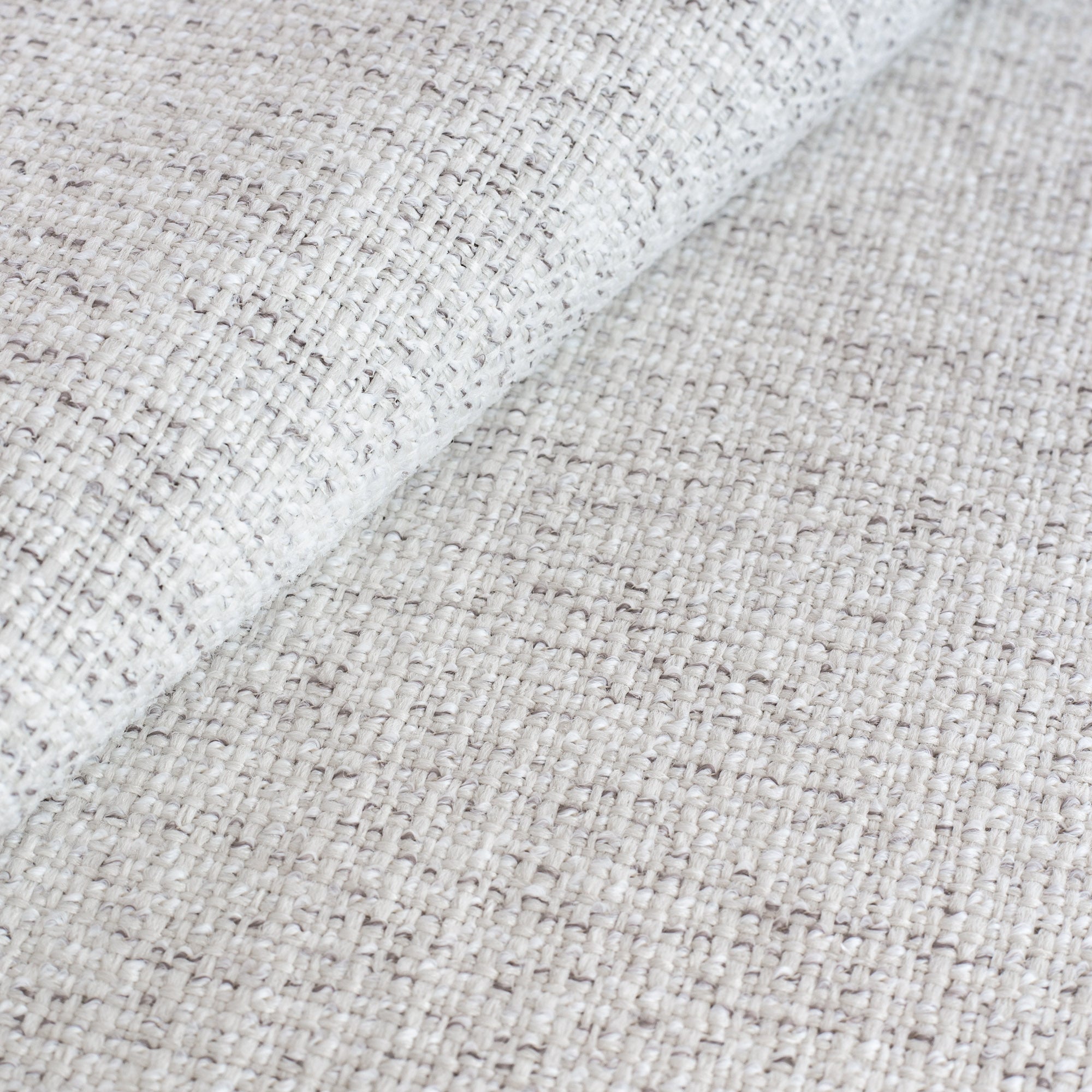 Preston Birch performance upholstery fabric, a light cream fabric, with strands of warm gray