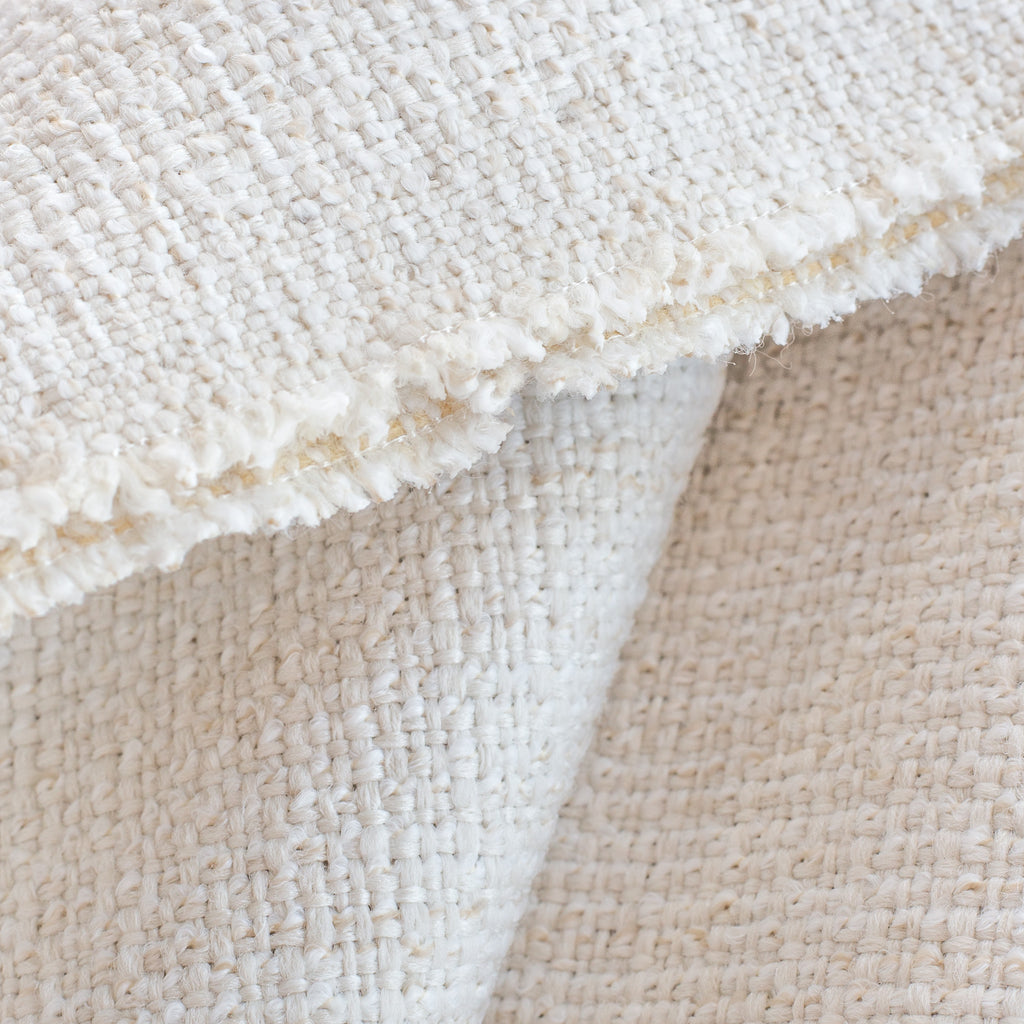Preston Oyster indoor outdoor fabric, a light cream basket weave fabric: close up view