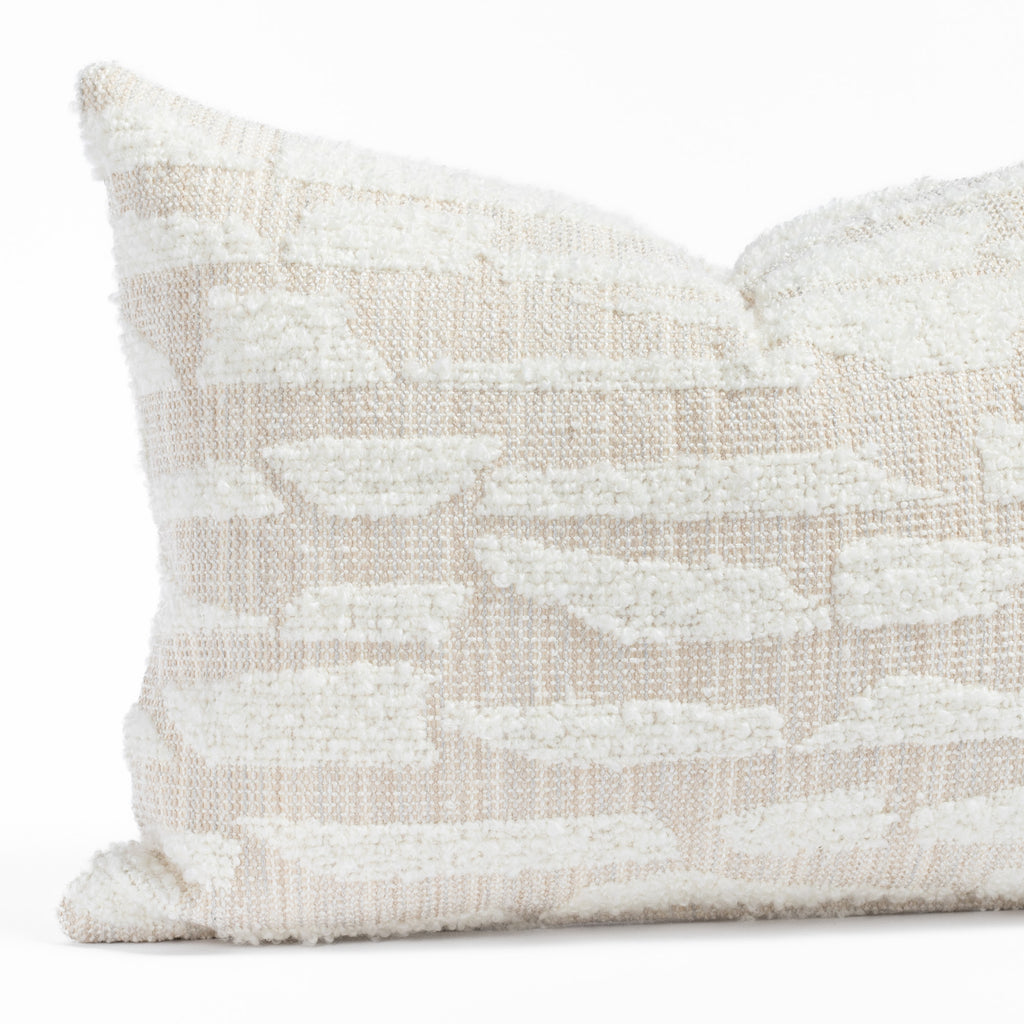  a cream textured abstract patterned lumbar throw pillow : close up view