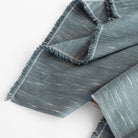 Rafael Stone Blue, a faded denim blue chunky weave cotton throw blanket from Tonic Living