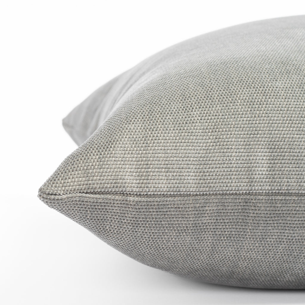 a soft light gray pillow : close up side view 