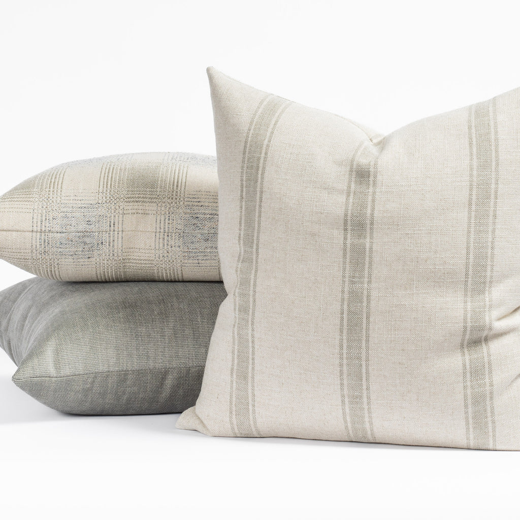Designer Tonic Living throw pillows in earthy green, cream and grey colours