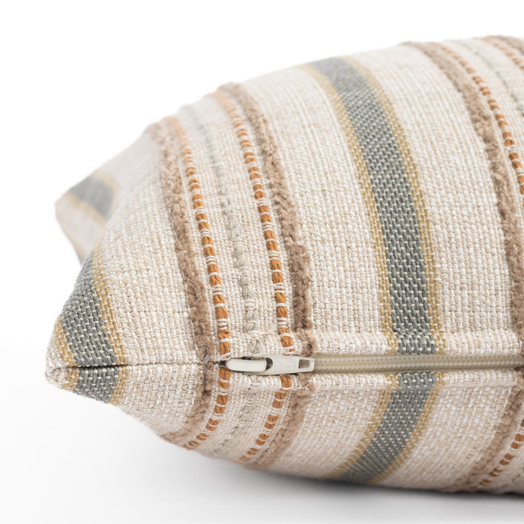 a beige, grey and terracotta earth toned vertical multi striped lumbar pillow : close up zipper view