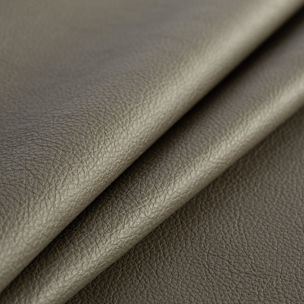 a charcoal gray green performance vinyl upholstery fabric : close up view