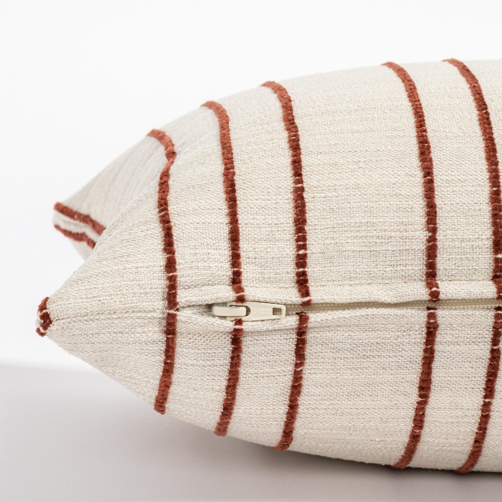 beige and rust stripe lumbar throw pillow : zipper side view
