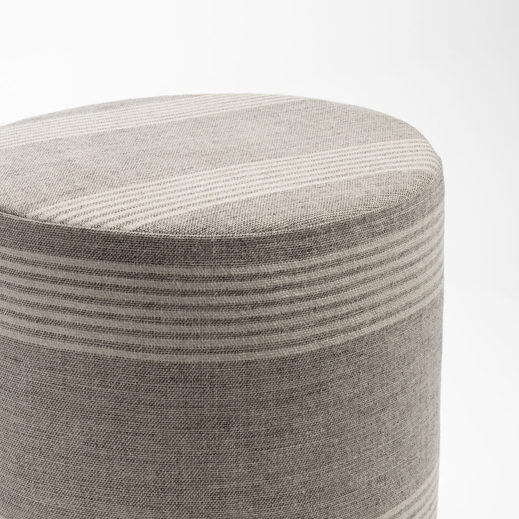 a natural tan and faded black striped linen round ottoman : top view