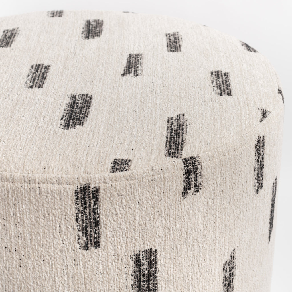 Stratus 18x16 Round Ottoman Cream, a cream with painterly black stroke patterned fabric ottoman : close up top view 2