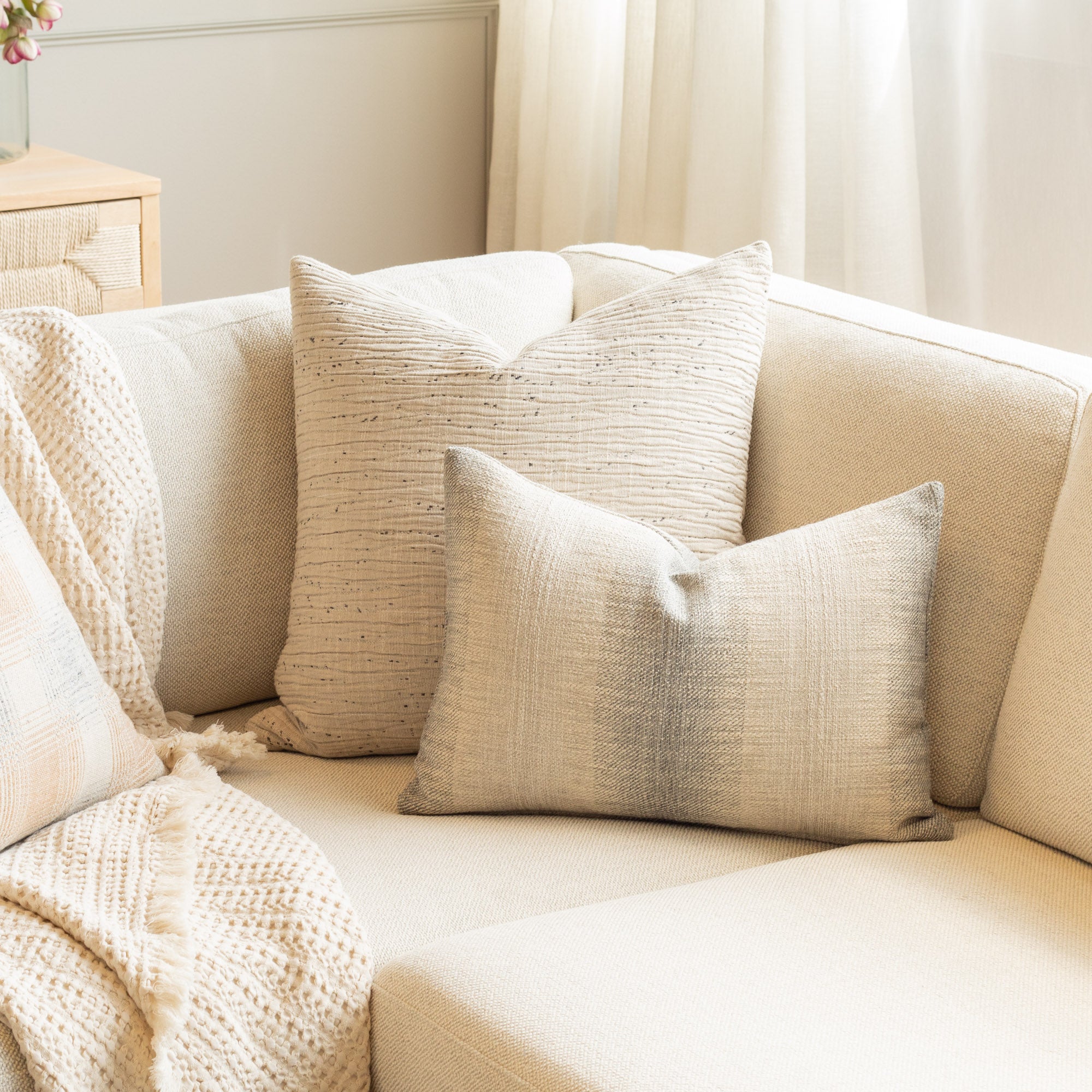 Neutral home decor : textured sandy grey and smokey blue Tonic Living throw pillows