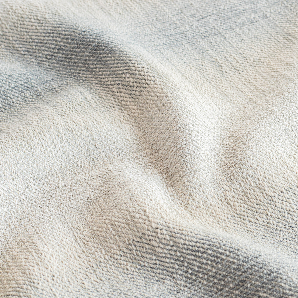 a denim blue and sandy grey ombre stripe fabric