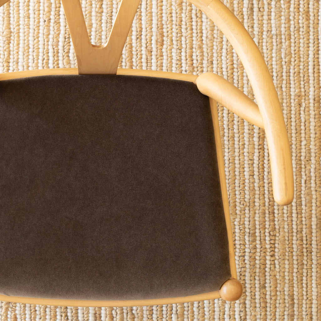 a deep brown velvet fabric chair seat