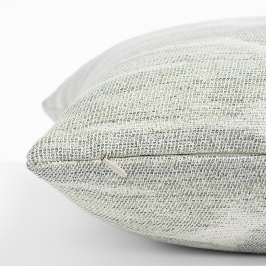 a blue jade green and cream swirl pattern throw pillow : close up zipper detail