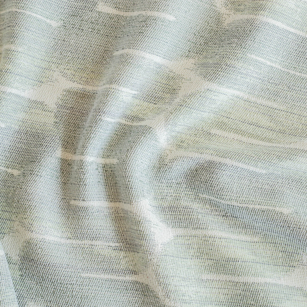 a watery blue, jade green painterly pattern upholstery fabric