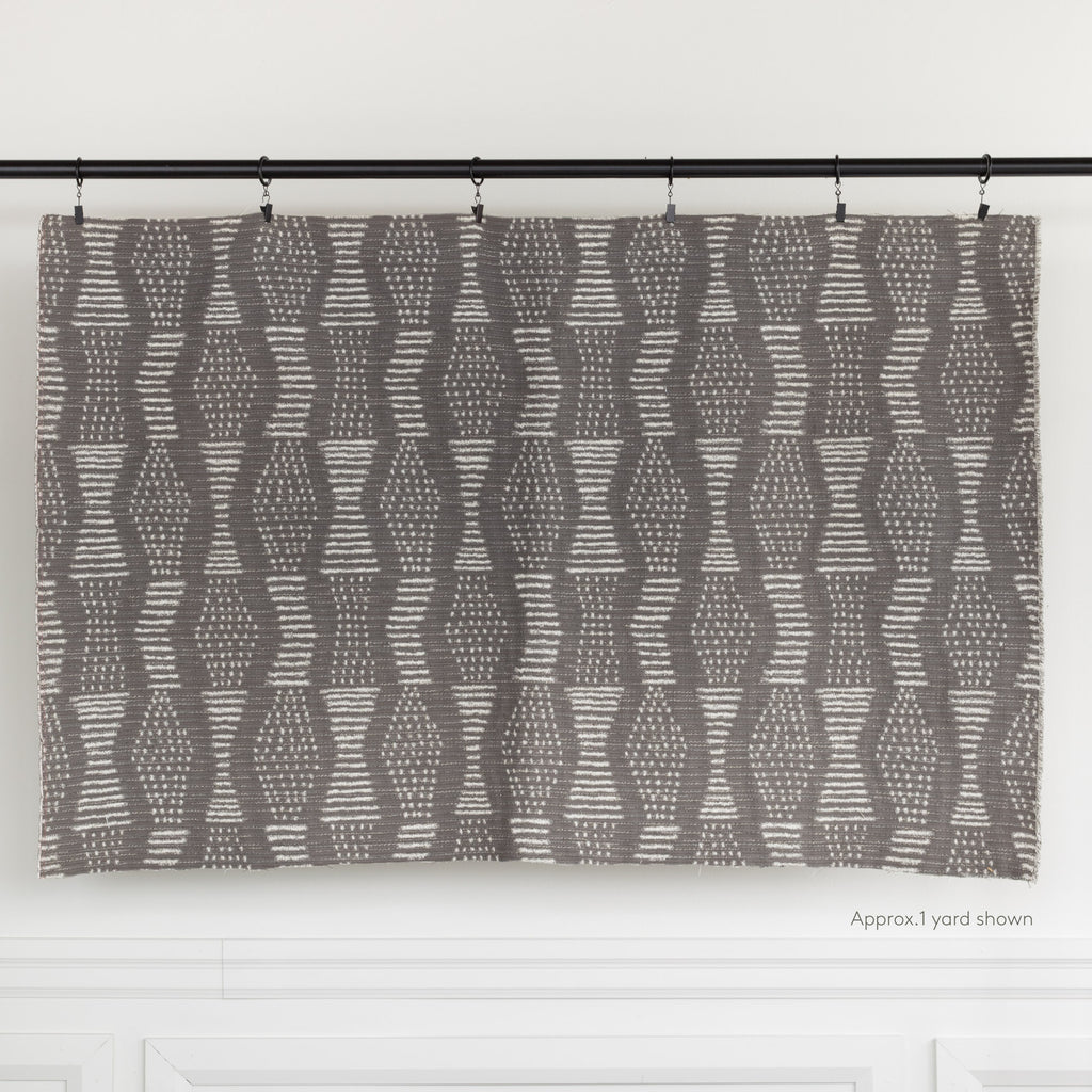 Zipporah Nickel, a dark gray upholstery fabric with cream dot dash motifs : one yard cut